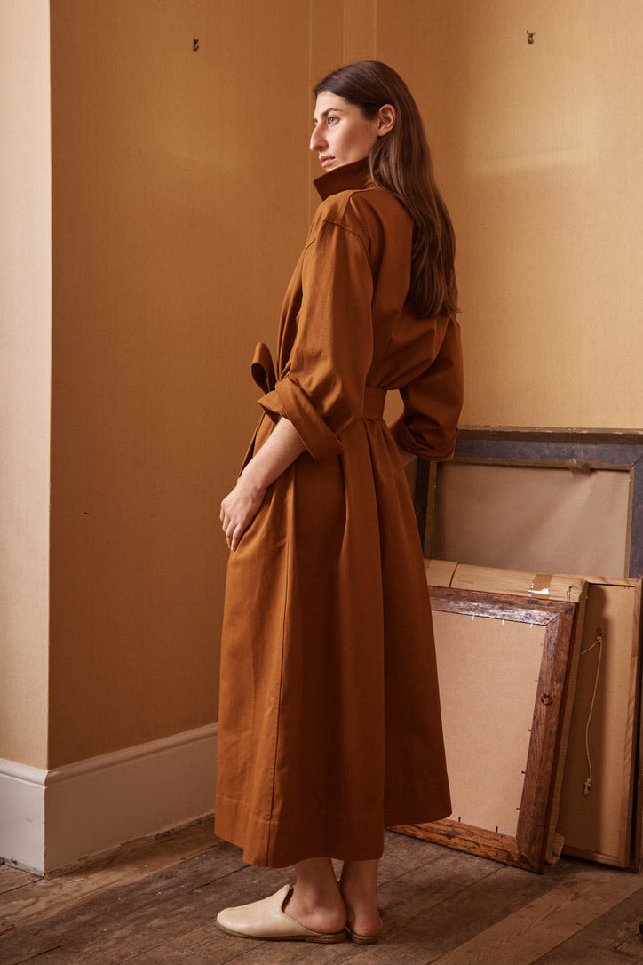 The cotton artist dress in rust.  Cloth.Work