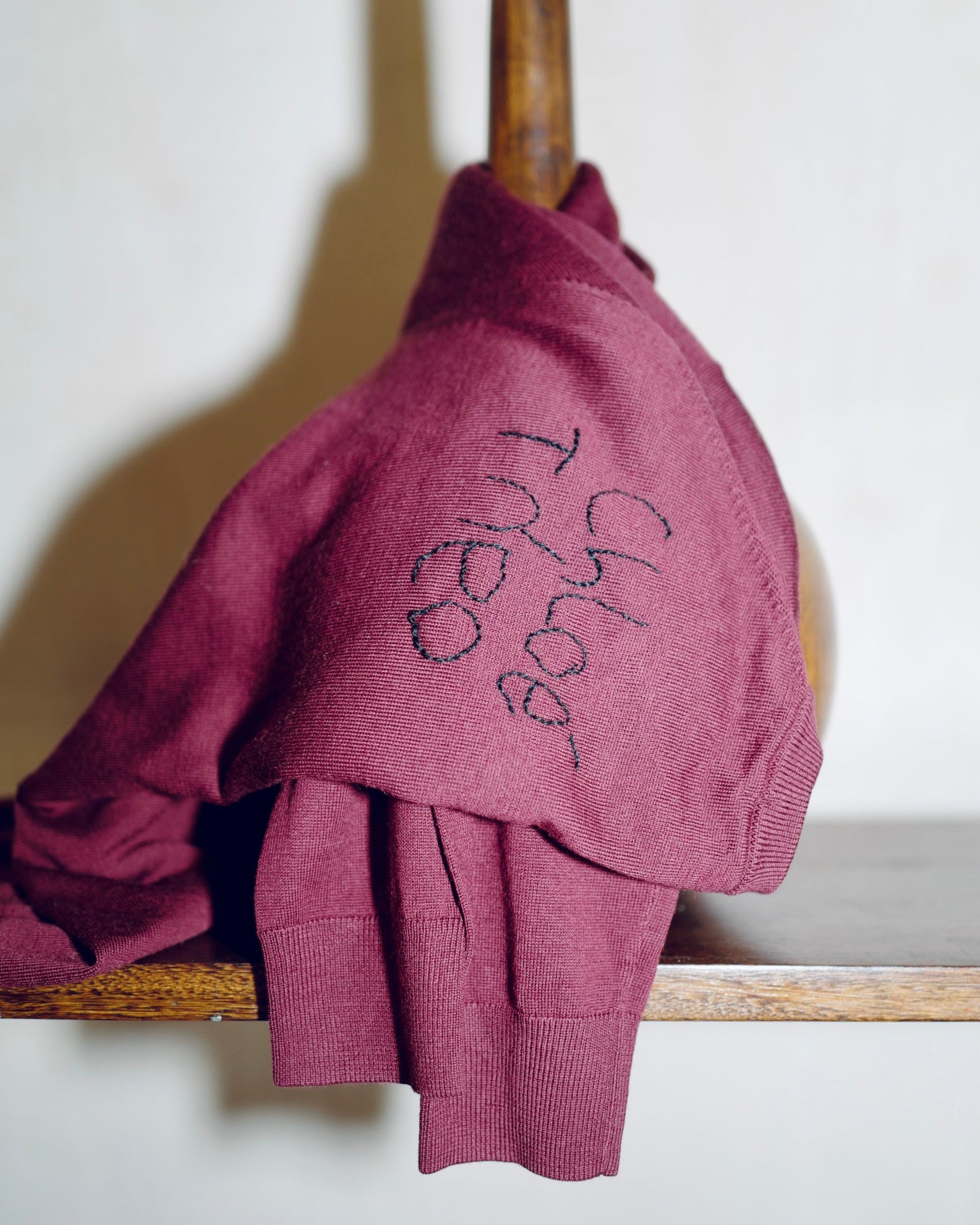 Handwritten names, fine knit.