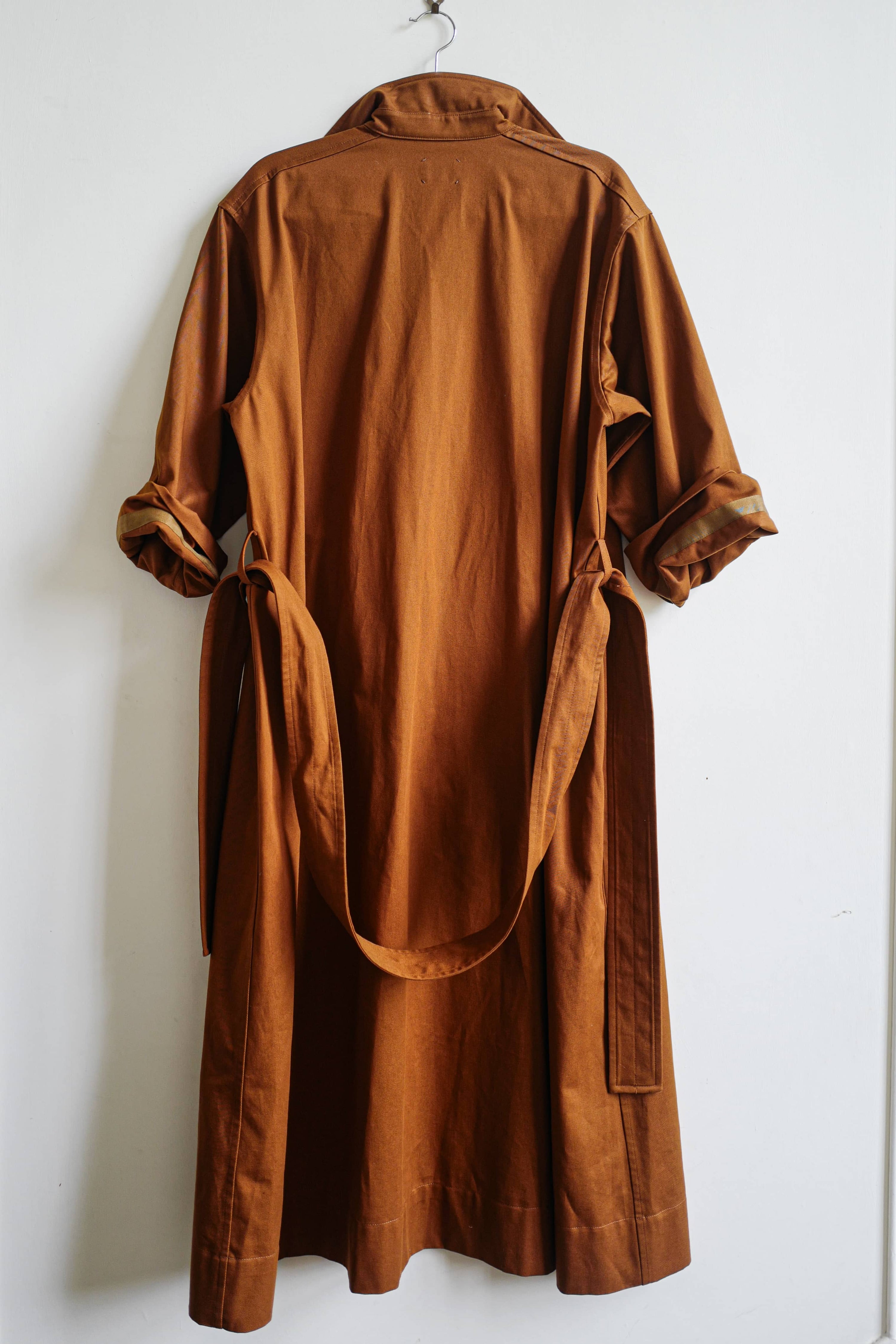 The cotton artist dress in rust.